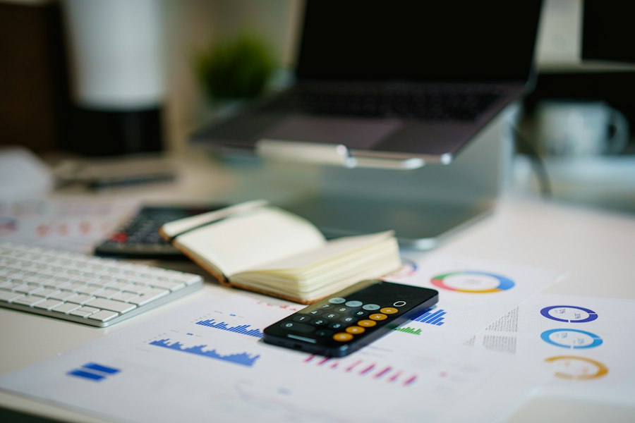 Financial charts and calculator on an office desk