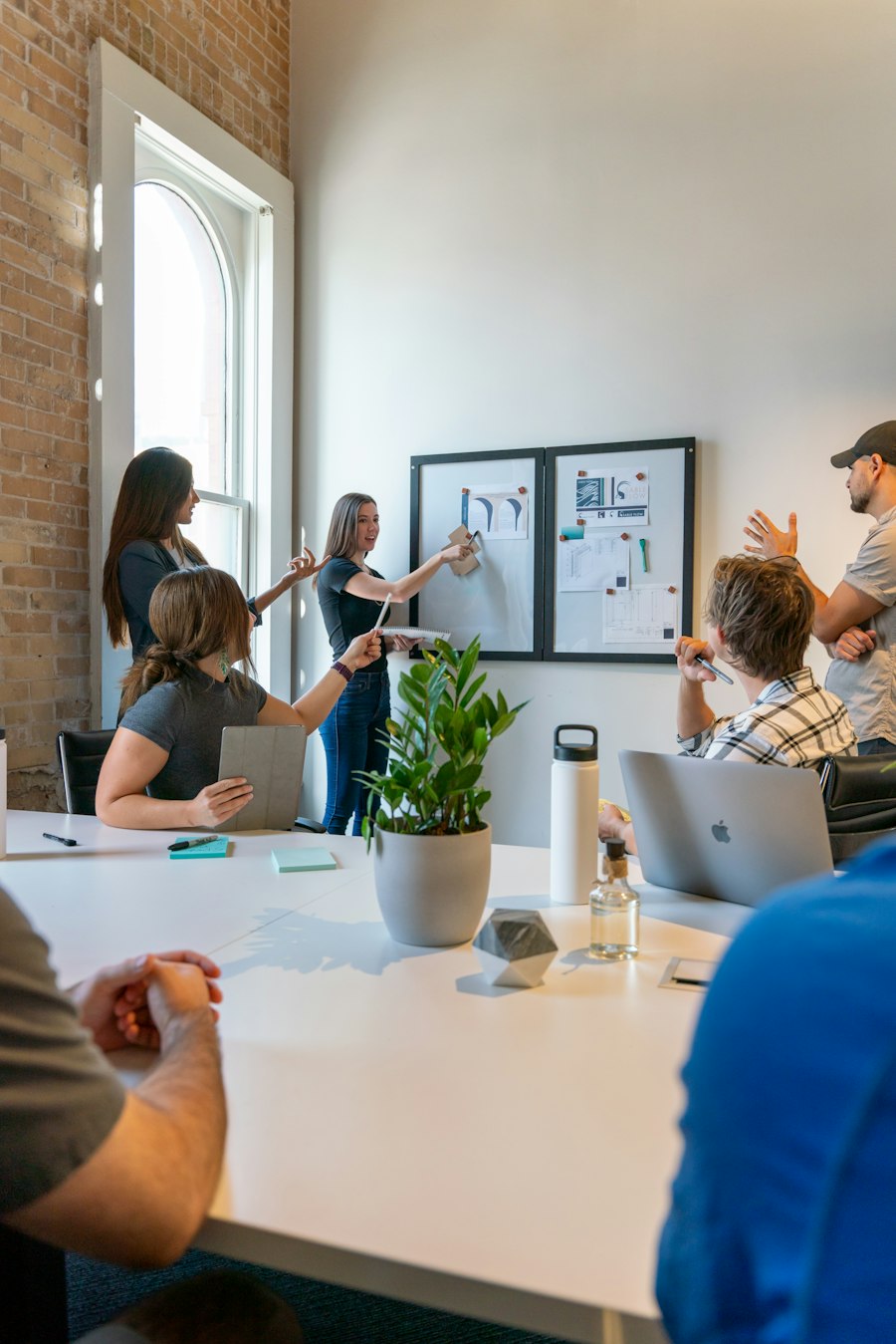 Team planning a project around a whiteboard